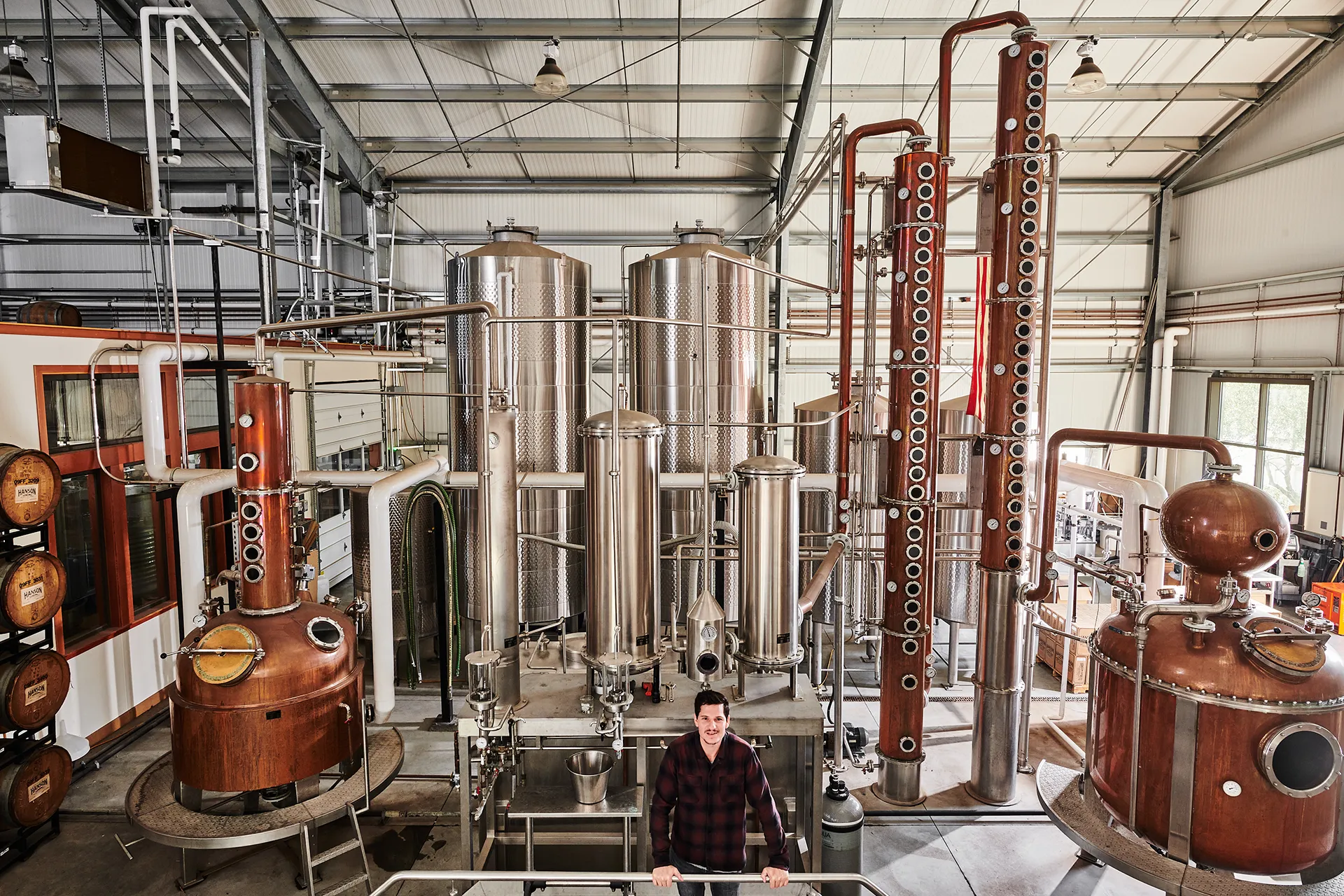 Chris Hanson operating distillery machinery