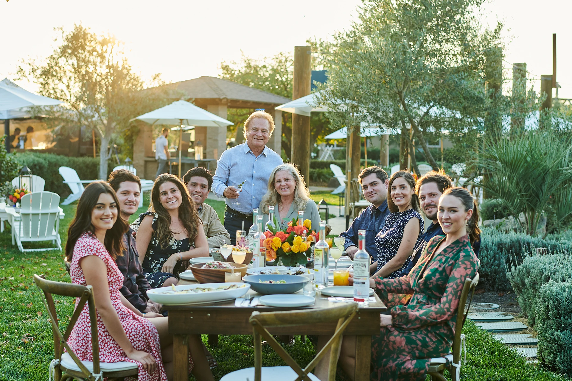 Chef serving platter of food for guests drinking hanson vodka