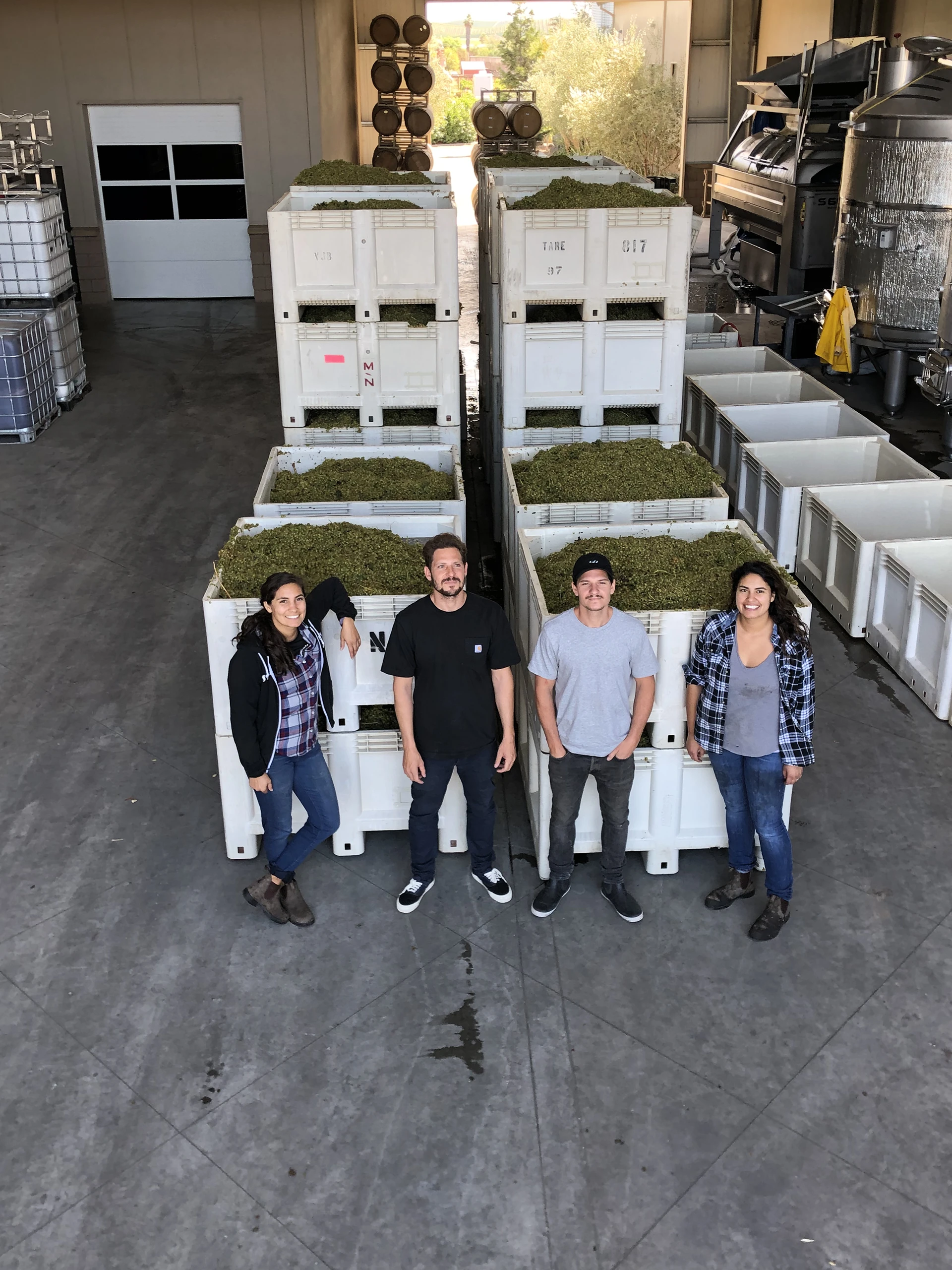 Ceja family standing in front of vineyard