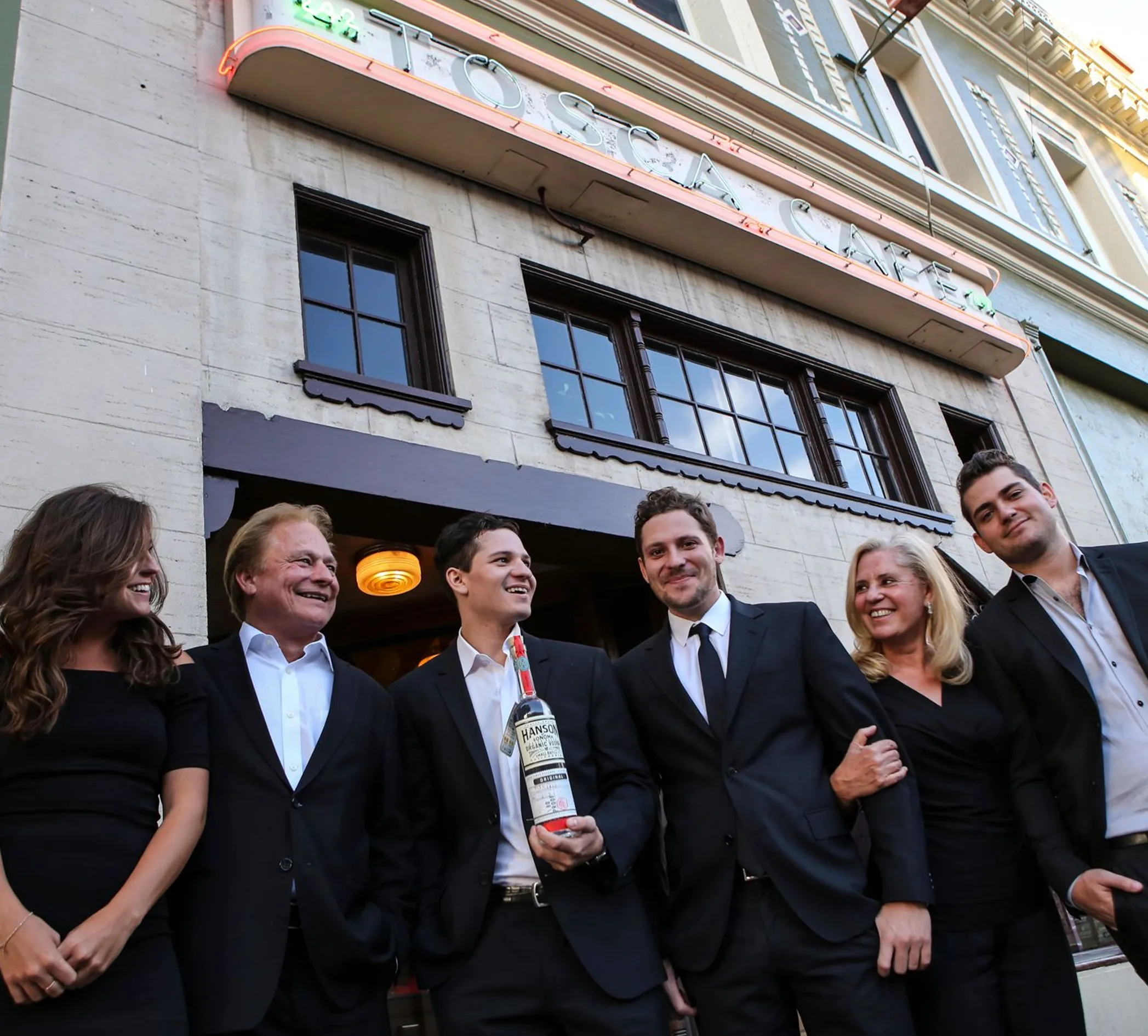 Hanson family in dinner suits in front of building